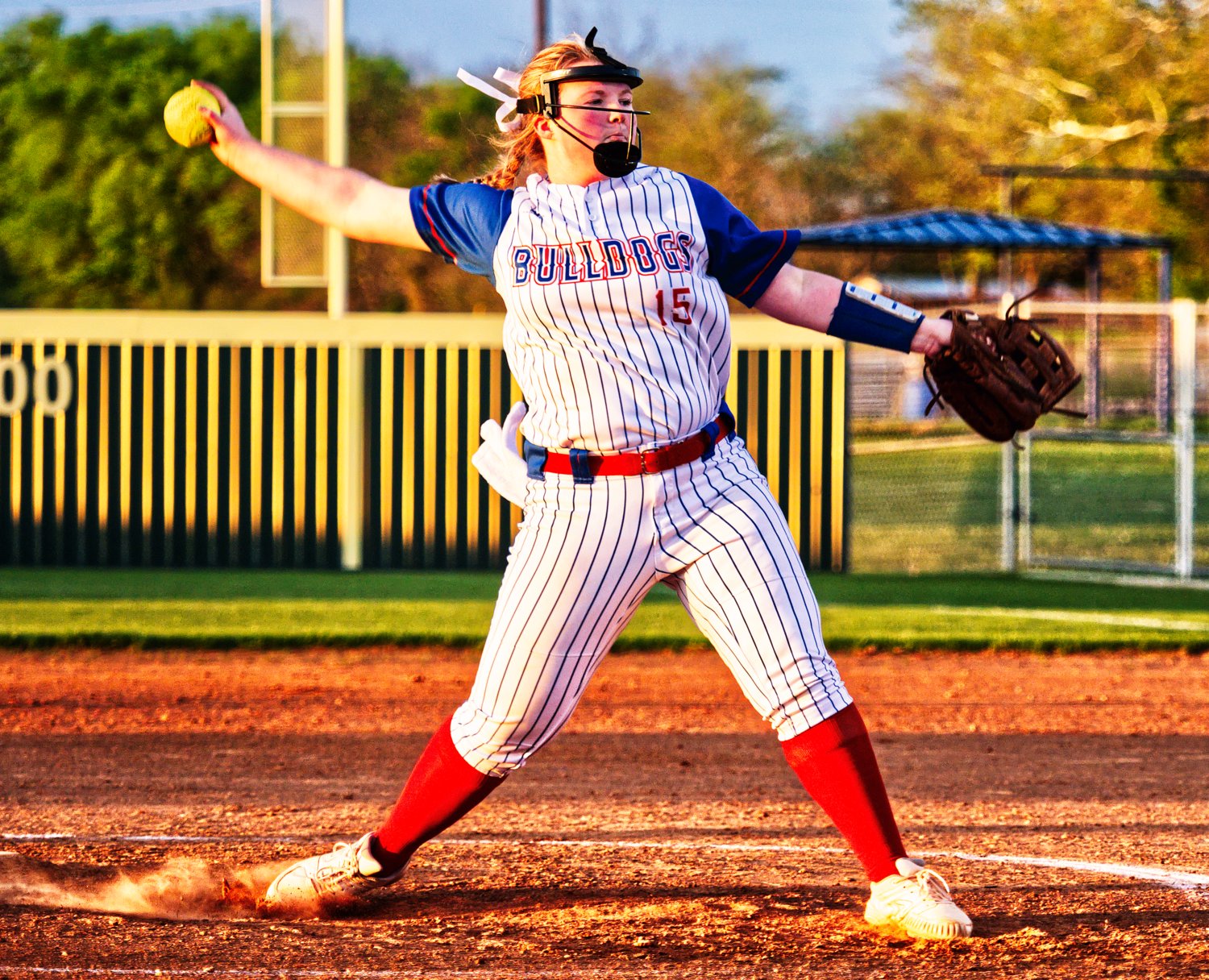 Kennedi Elmore throws a pitch in the middle innings of her complete game. [see more softball]
